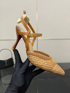 Tan woven heeled sandal with T-strap and pointed toe, high stiletto heel.