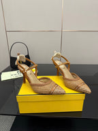Pointed-toe heeled sandals with tan woven uppers and ankle strap, stiletto heel.