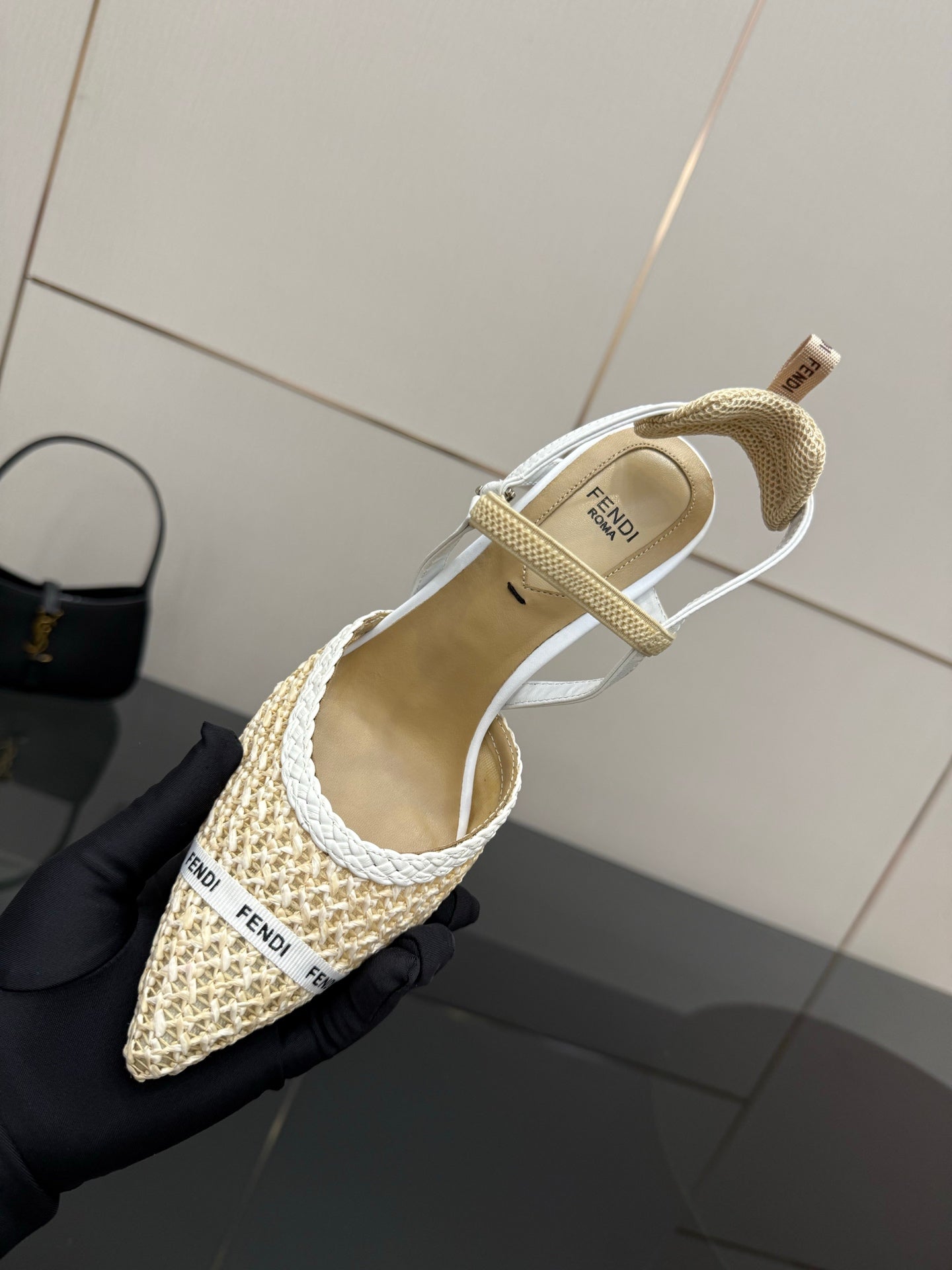 Women’s woven slingback heel shown from side, ankle strap and pointed toe, light beige
