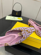 Fendi mule shoes close-up: pink leather interior and FF patterned strap with gold buckle