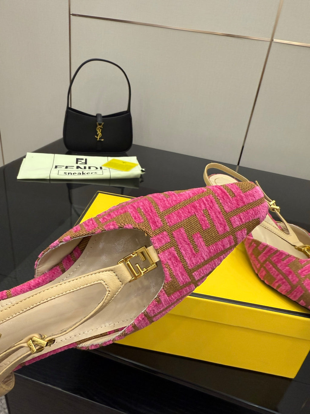 Fendi ladies slingback heels close-up, gold buckle on pink patterned strap