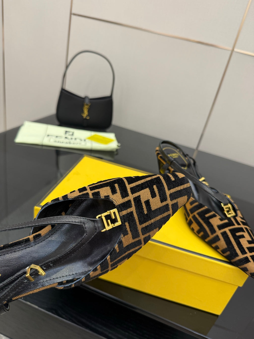 Fendi FF-pattern slingback heel close-up with black leather strap