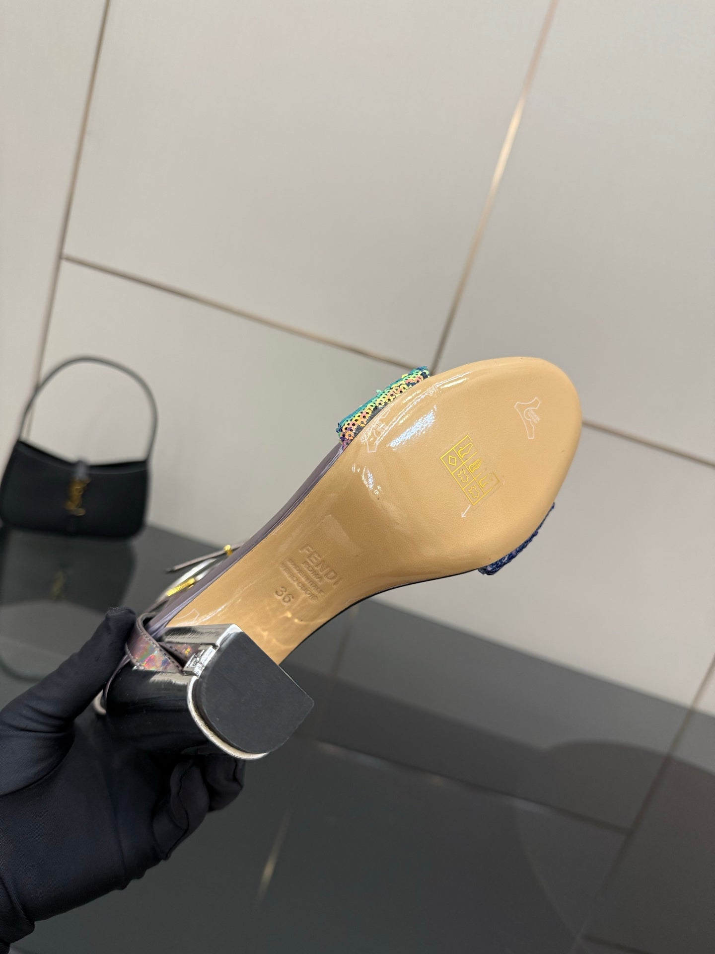 Fendi sandal outsole with multicolor logo patch on tan rubber sole