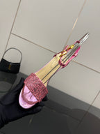 Pink strappy high-heel sandal showing open toe and glitter ankle cuff