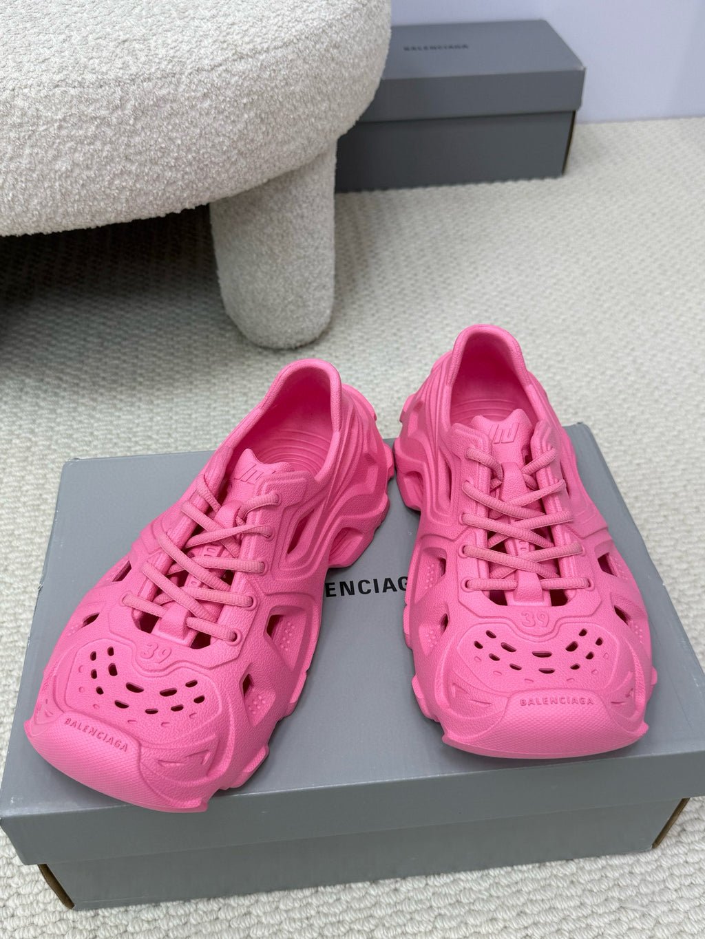 Balenciaga pink slide sandals with cutout upper, perforated toe, and chunky sole