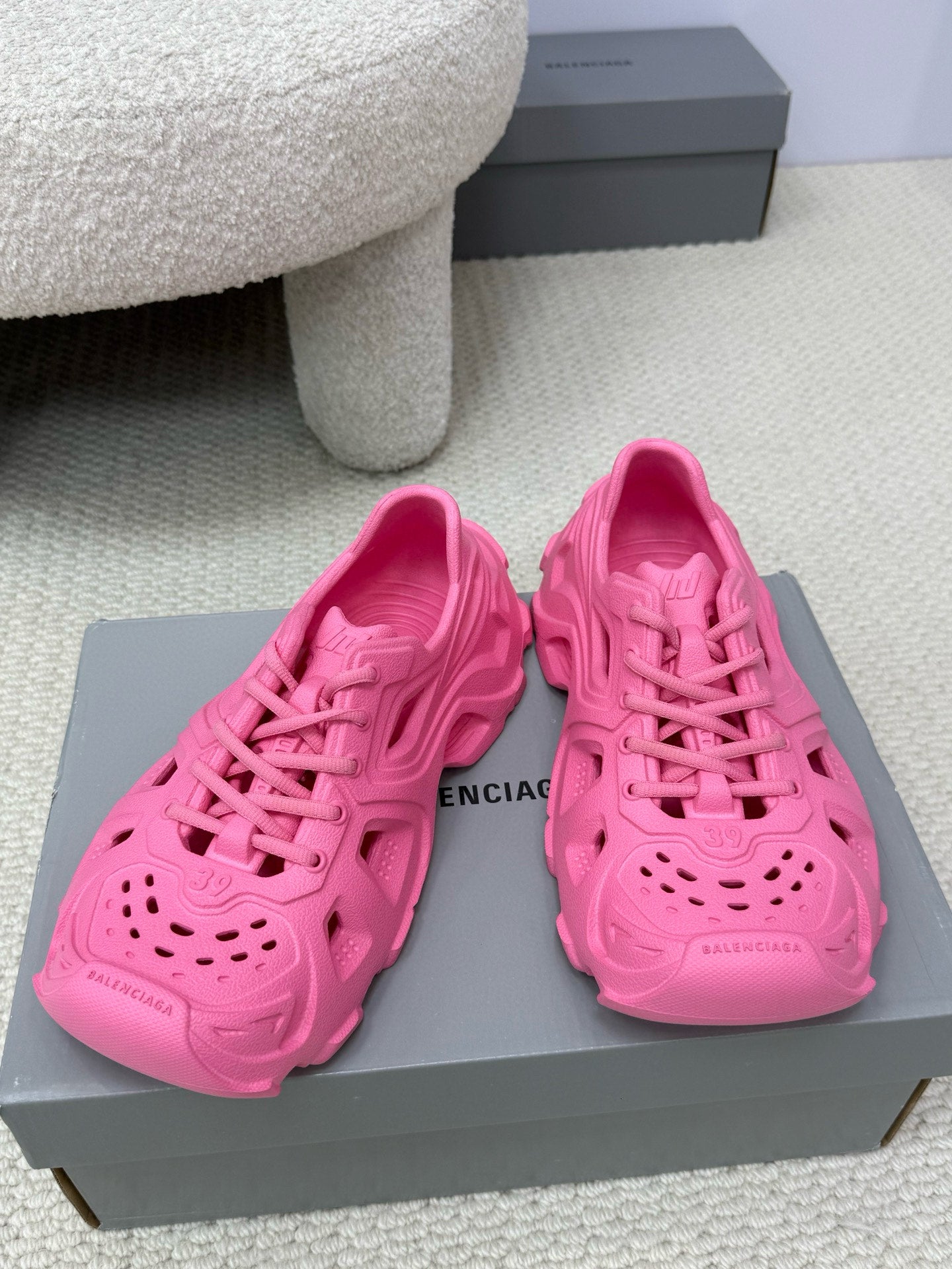 Balenciaga pink slide sandals with cutout upper, perforated toe, and chunky sole