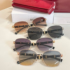 Stack of round sunglasses with mixed lenses, gold frames, and black temples