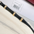 Black sunglasses temples with gold hardware and Gucci script detail