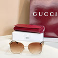 Gucci glasses with round gold frame and tinted brown lenses