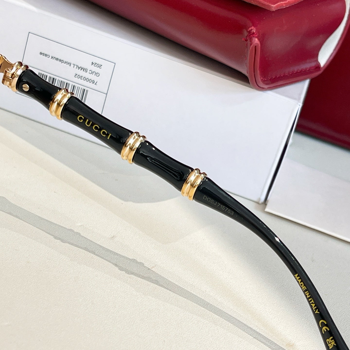 Gucci glasses black temple with gold logo accents and hinge