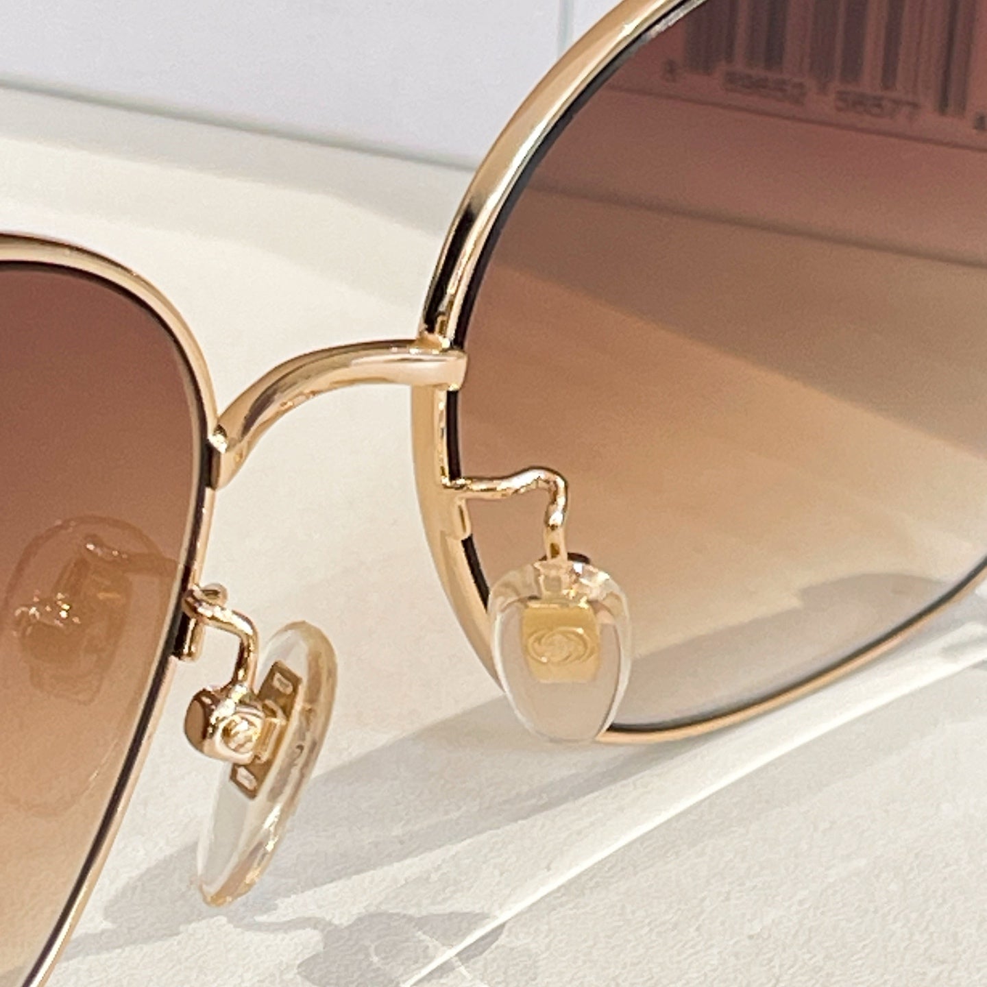 Gucci glasses gold bridge with round tinted lenses and black temple