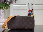 Louis Vuitton bag with tan shoulder strap, dark brown monogram canvas side profile