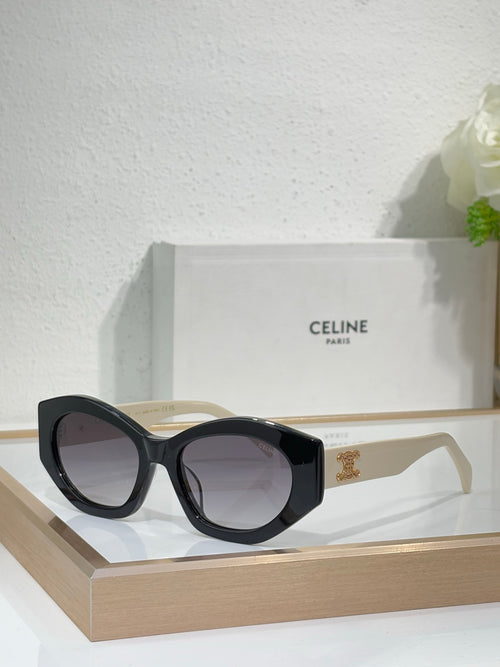 Celine sunglasses with black cat-eye frames, dark lenses, and gold emblem temple detail