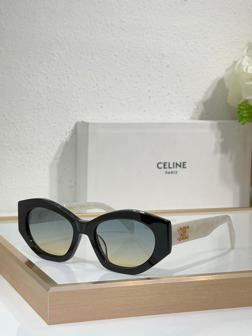 Celine sunglasses with black oversized frames, dark lenses, and gold logo at temples