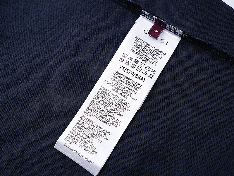 Navy T-shirt with white care label at inner side seam