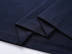Navy T-shirt fabric folds with stitched sleeve cuff and hem