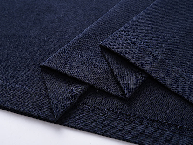 Navy T-shirt fabric folds with stitched sleeve cuff and hem