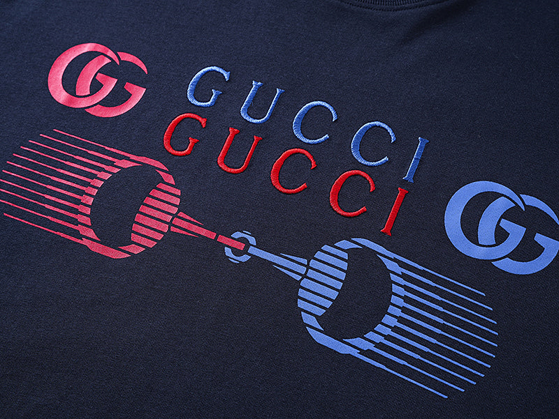 Navy T-shirt chest graphic with Gucci text and GG logos in red and blue