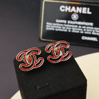 Chanel earrings with red enamel CC logo on gold-tone studs
