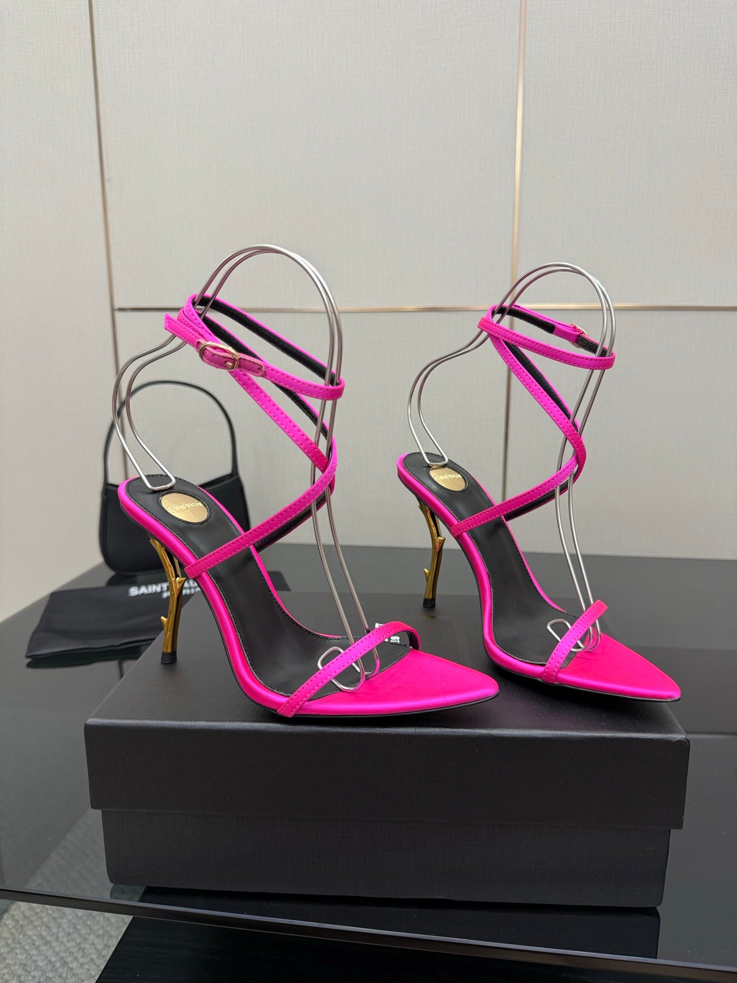 Womens YSL strappy stiletto heels: hot pink, black straps, gold-tone heel