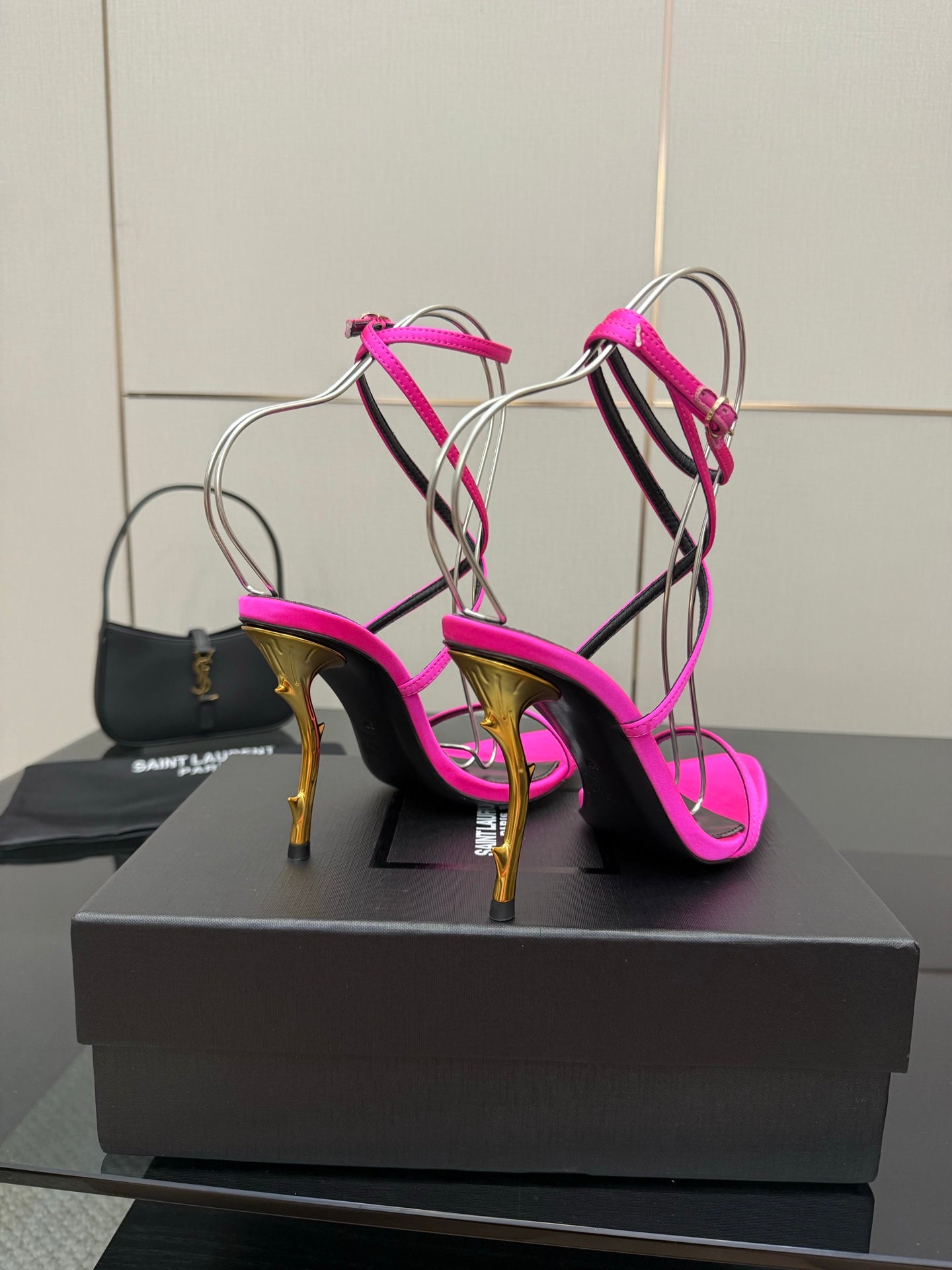 Womens YSL strappy stiletto heels, hot pink with black straps and gold-tone heel