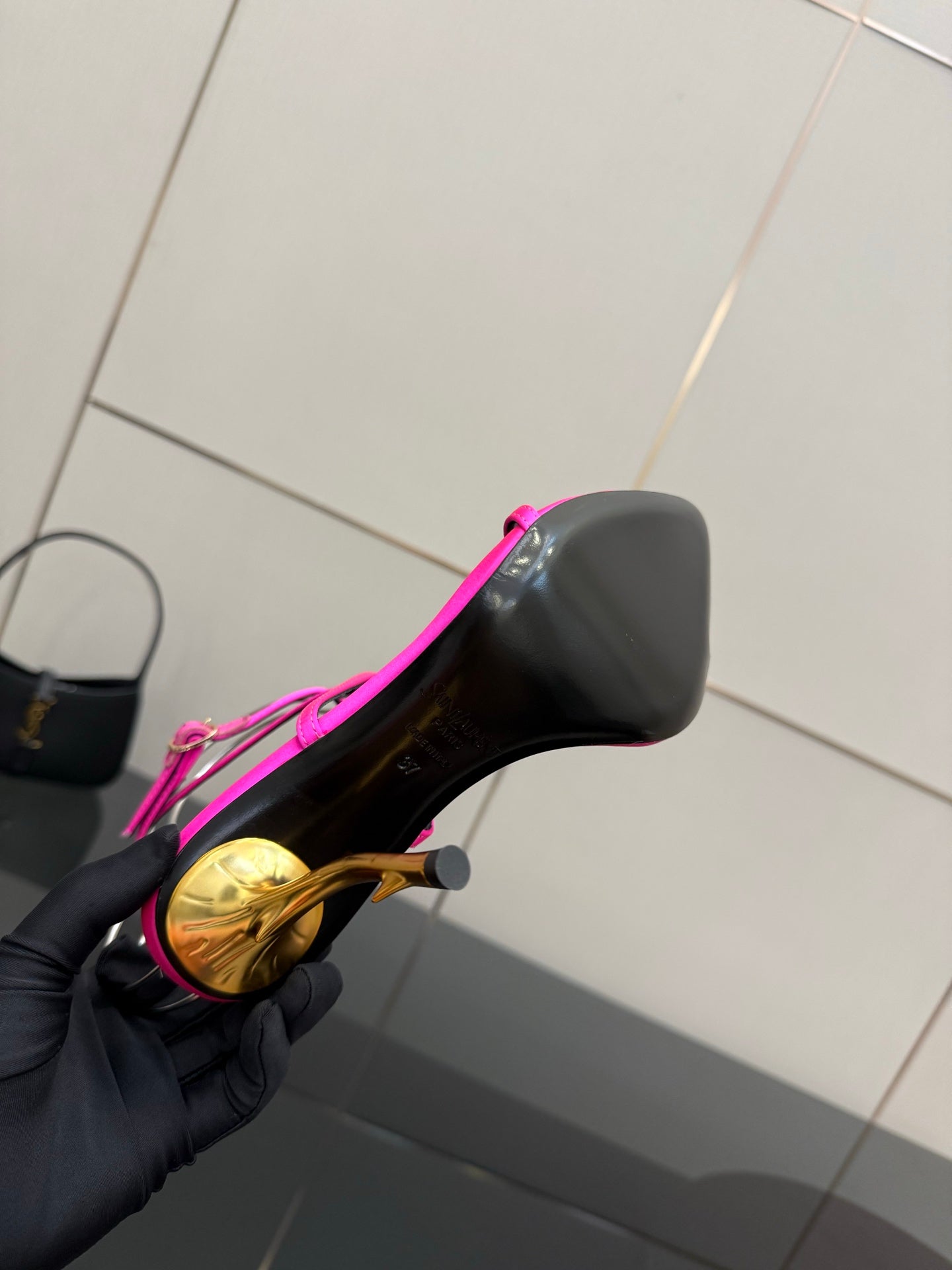 Womens YSL stiletto heel underside, black sole and gold-tone heel