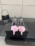 YSL ladies pink pointed-toe heels with pink flower appliques and gold-tone stiletto