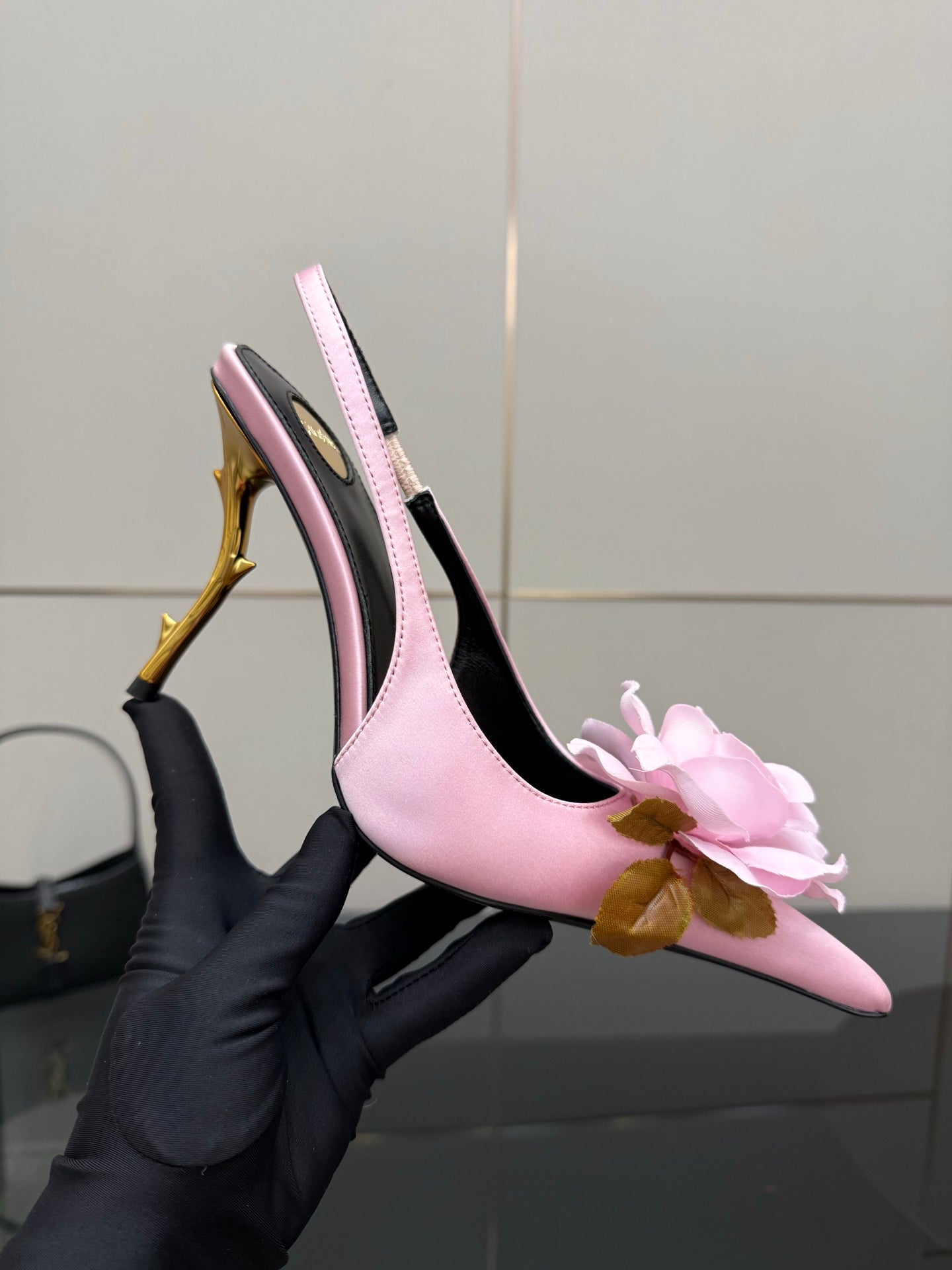 YSL ladies pink slingback heel with pink flower detail and gold stiletto