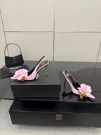 YSL ladies pink pointed-toe heels with flower appliques and gold stiletto, side view