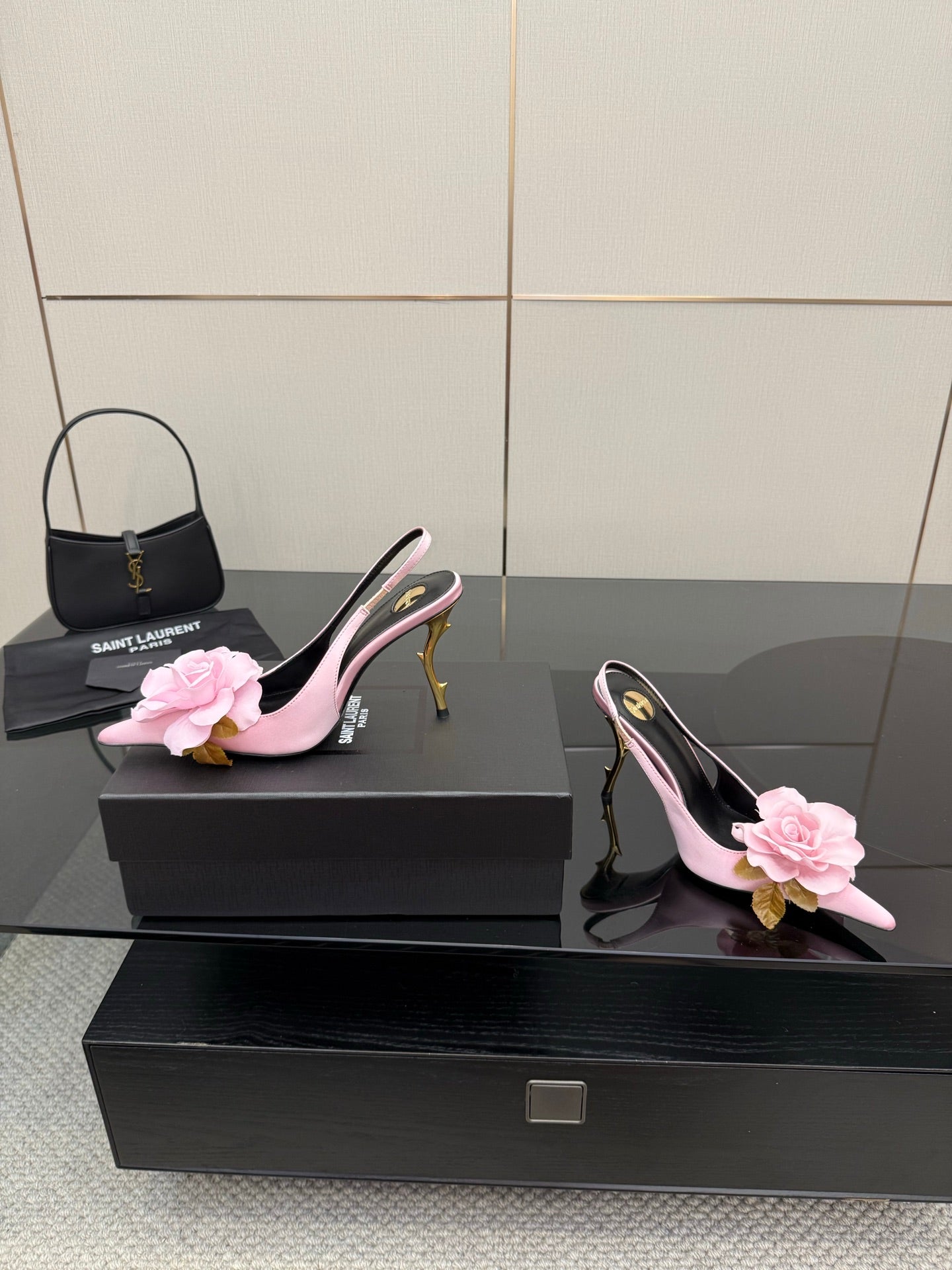 YSL ladies pink pointed-toe heels with flower appliques and gold stiletto, side view