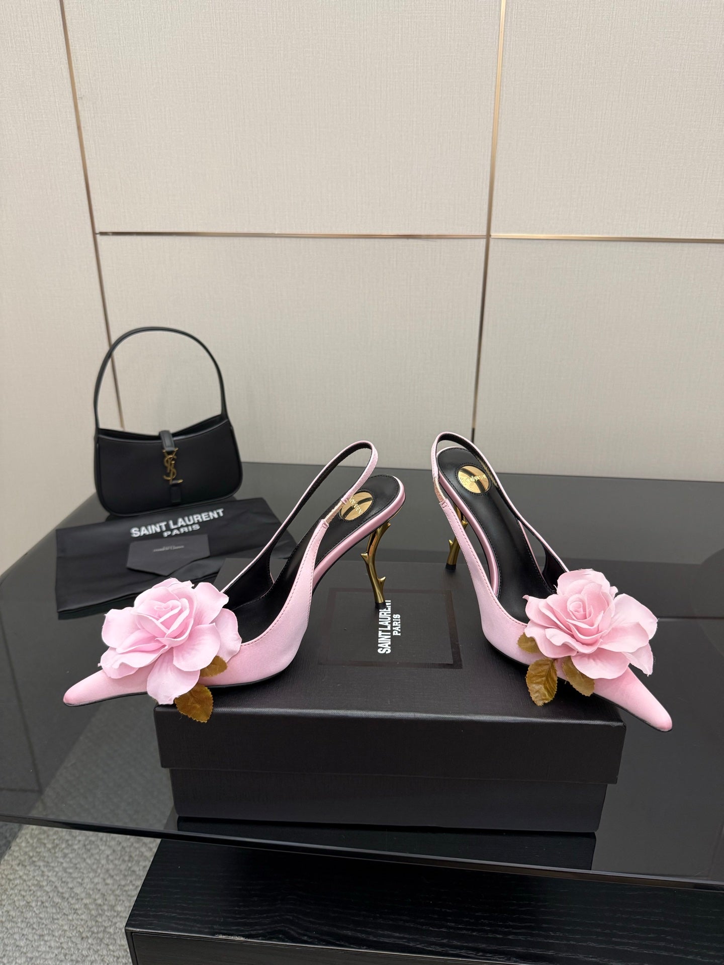 YSL ladies pink pointed-toe heels with large pink flower decor and gold stiletto