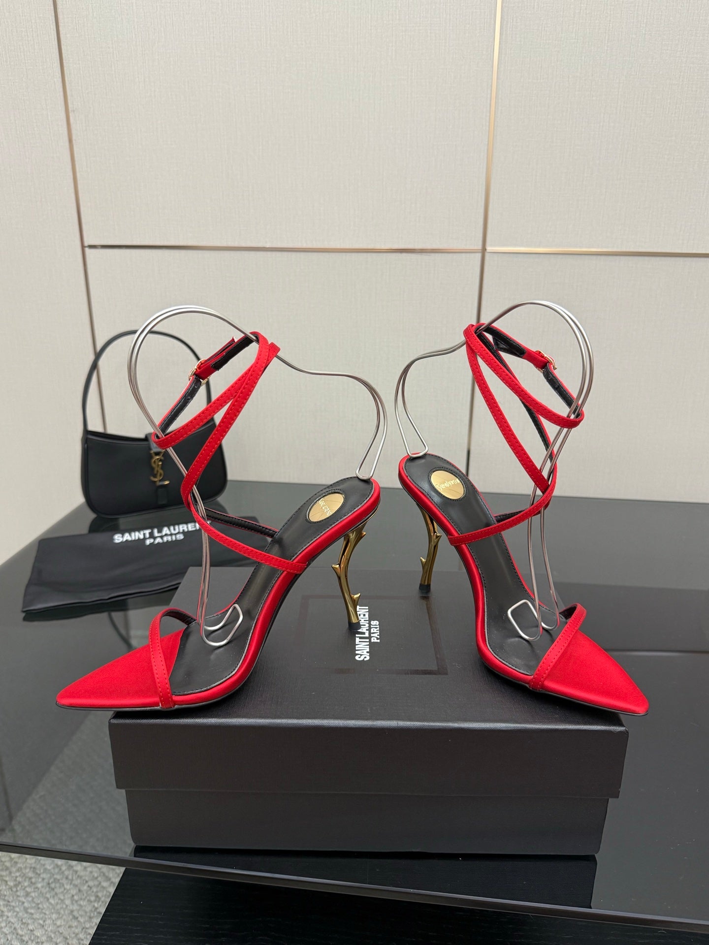 YSL ladies red and black heeled sandals with gold stiletto heel and crisscross ankle straps