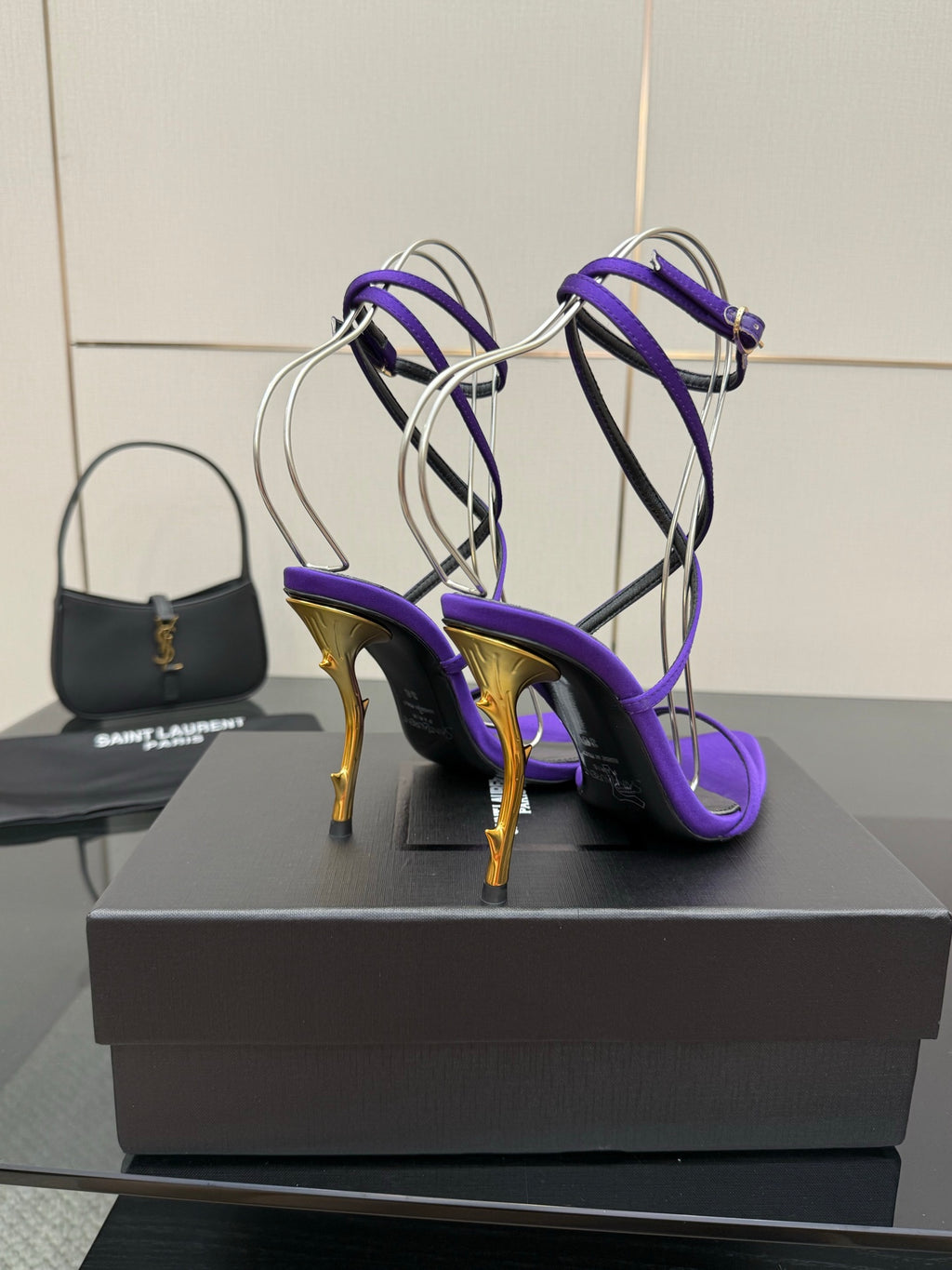 Purple open-toe strappy high-heel sandals with gold-tone heels, side view