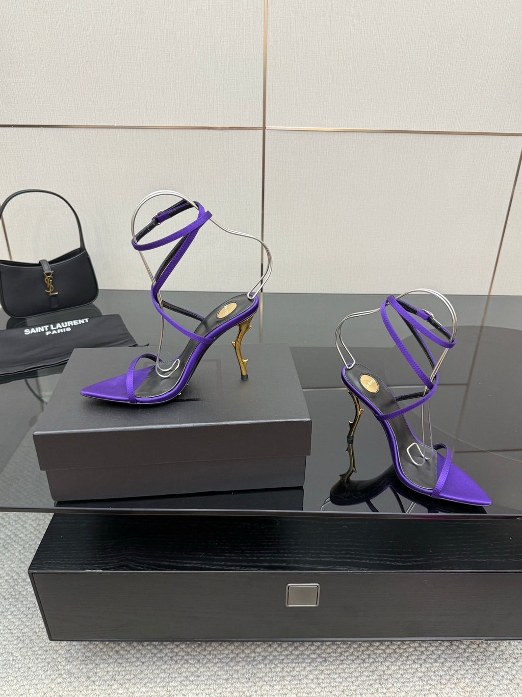 Purple strappy high-heel sandals with lace-like ankle straps and pointed toe
