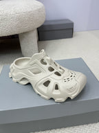 Balenciaga white sculpted slide sandals, side cutouts and treaded sole