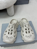 Balenciaga white slide sandals with perforated upper and chunky outsole