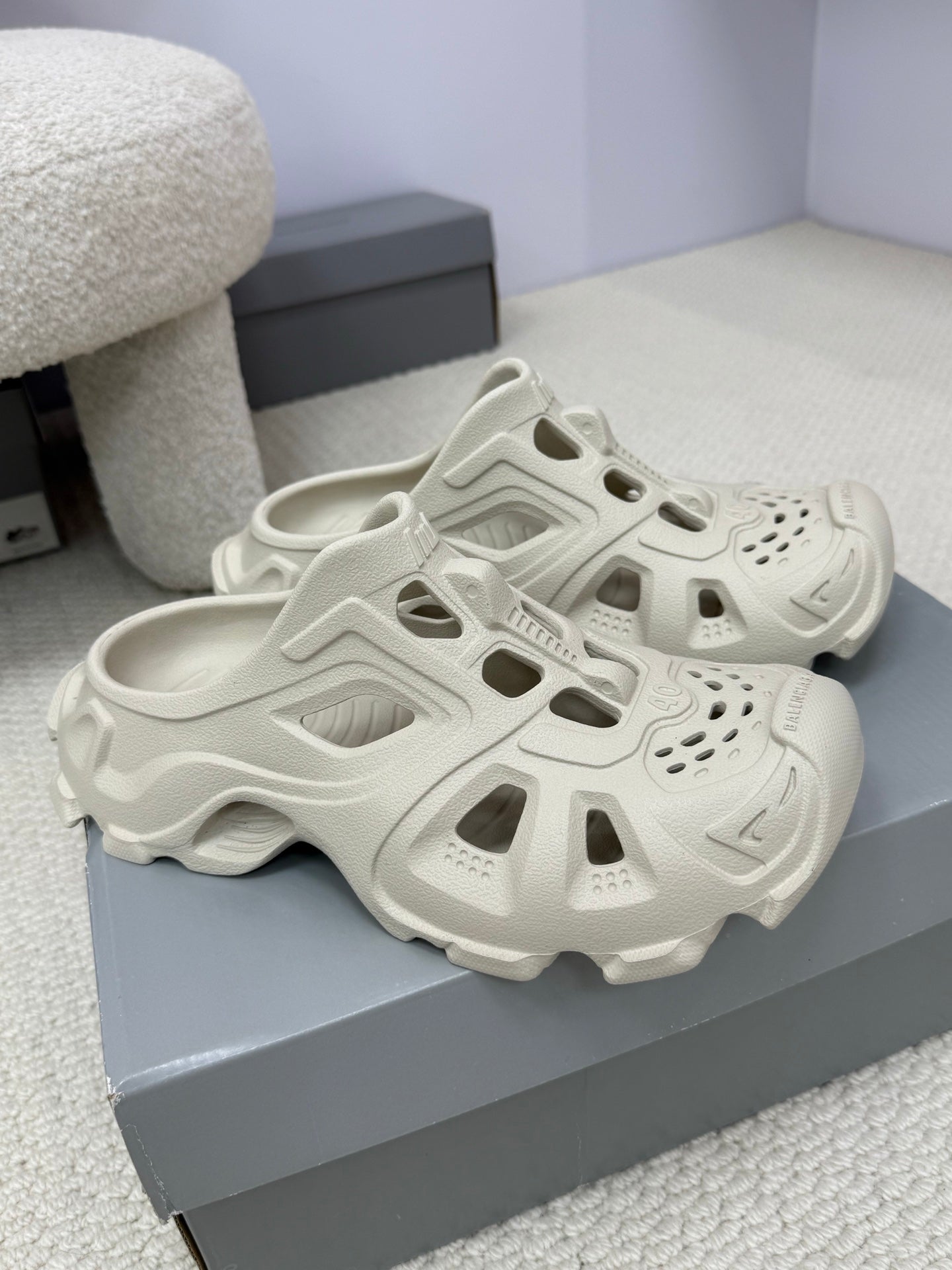 Balenciaga white slide sandals pair, chunky tread sole and cutout design