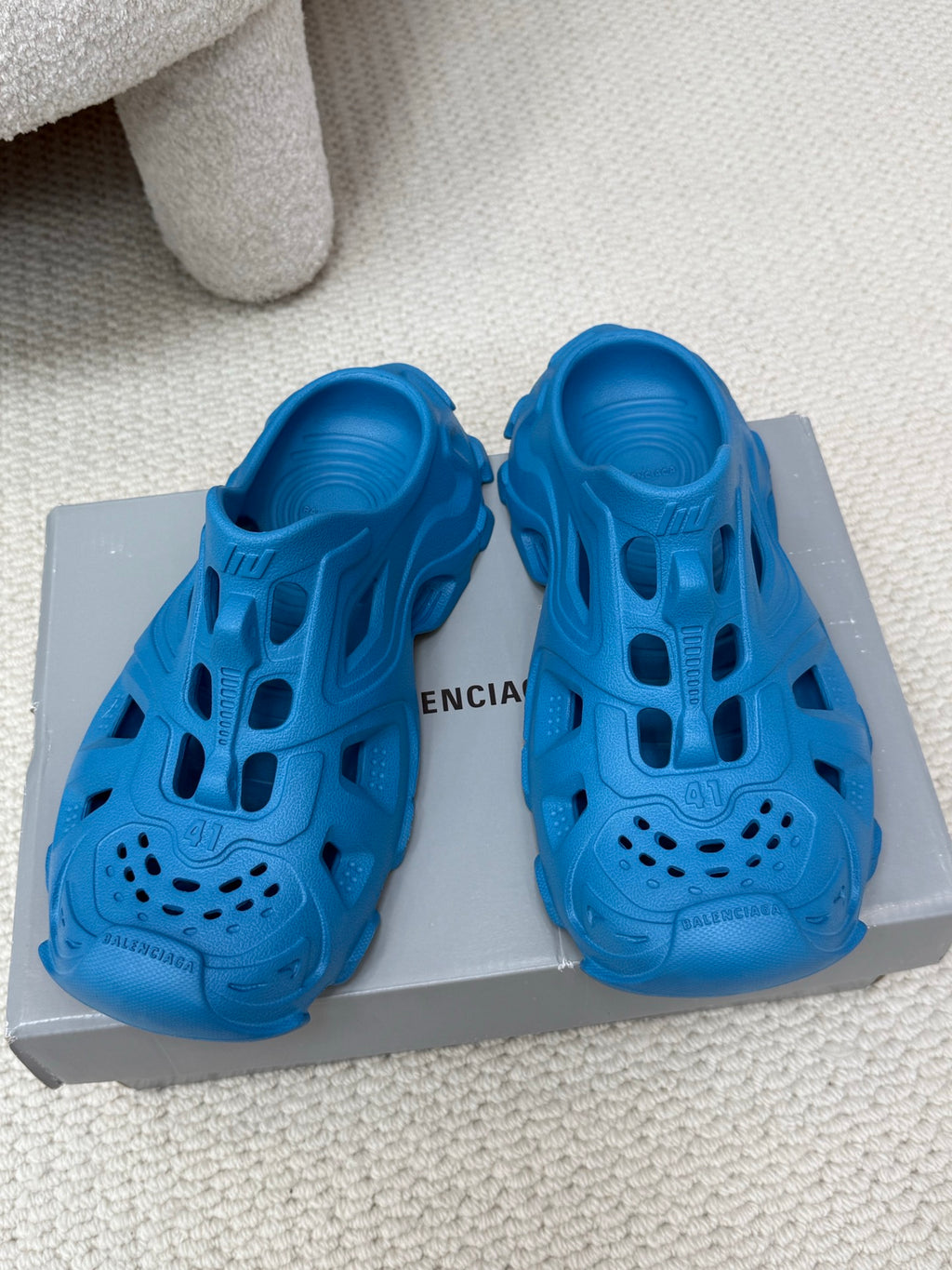 Balenciaga blue slide sandals with cutout upper, perforated toe, and chunky sole