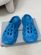 Balenciaga blue slide sandals with cutout upper, perforated toe, and chunky sole
