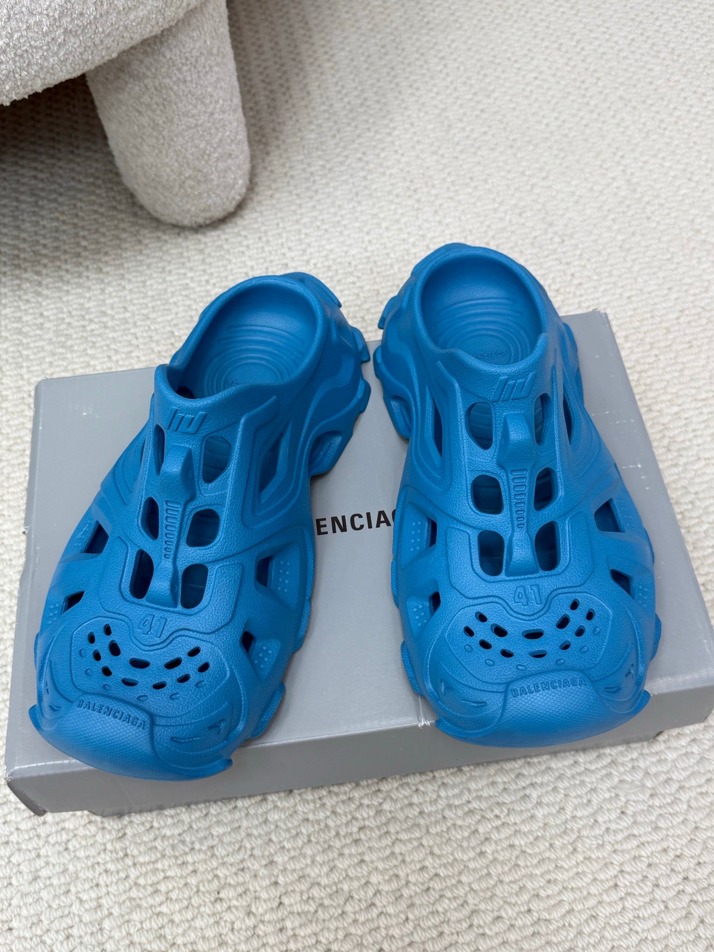 Balenciaga blue slide sandals with cutout upper, perforated toe, and chunky sole