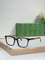 Gucci eyeglasses with black rectangular frame and brown tortoise temple tips
