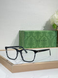 Gucci eyeglasses with dark rectangular black frame and clear lenses