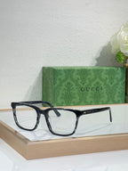 Gucci eyeglasses with dark rectangular black frame and clear lenses
