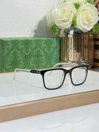 Gucci eyeglasses with black rectangular frame and clear lenses, side-by-side view
