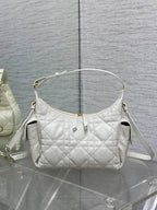 White quilted hobo shoulder bag with gold-tone hardware and two top handles