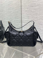 Dior bag, black quilted shoulder bag with curved top opening and crossbody strap