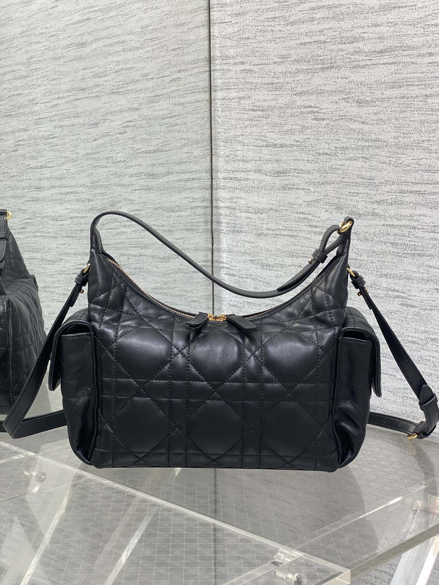Dior bag, black quilted shoulder bag with dual straps and gold zipper trim