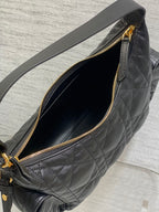 Dior bag, open zip-top with gold zipper and black quilted interior lining