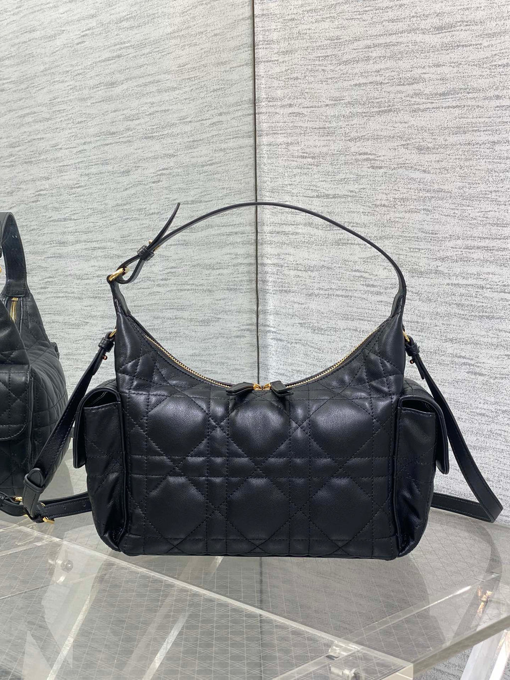Dior bag, black quilted shoulder bag with top handles and gold hardware