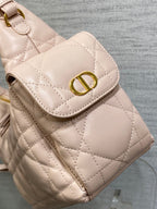 Light pink quilted mini bag with gold D-style clasp flap and top handle